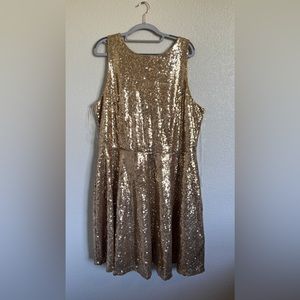 Gold sequin dress that hits just above the knee.